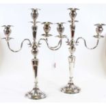 A pair of Mappin & Webb silver plated three branch table candelabra, in the Adam style, each