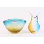 A 20th century coloured studio glass bowl, w.24.5cm; together with a similar vase, h.23cm (2)