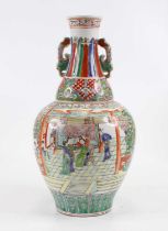 A Chinese porcelain vase,enamel decorated with figures within an interior scene, height 37cm