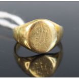 A yellow metal oval signet ring, with worn engraving and engraved 'Florence' inside head, size P½,