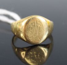 A yellow metal oval signet ring, with worn engraving and engraved 'Florence' inside head, size P½,