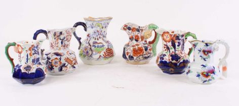 Six Victorian ironstone jugs, largest height 15cm