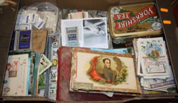 A collection of vintage postcards and cigarette cards to include Capstan and Brook Bond