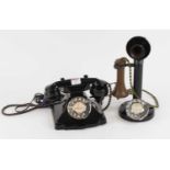 A vintage bakelite rotary telephone; together with another similar (2)