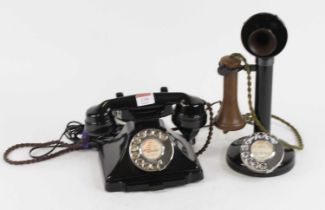 A vintage bakelite rotary telephone; together with another similar (2)