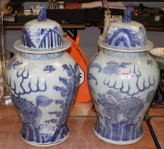 A large pair of Chinese blue & white vases and covers, each decorated with dragons, height 51cm