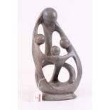 A 20th century carved hardstone stylised figure group, signed Nathan Kay to the reverse, height