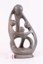 A 20th century carved hardstone stylised figure group, signed Nathan Kay to the reverse, height