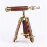 A brass and hardwood tripod telescope