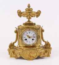 A late 19th century French gilt bronze 8-day mantel clock, the enamel dial with Roman numerals and