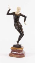 After Ferdinand Preiss, an Art Deco style bronzed spelter and resin figure of a dancer, upon a