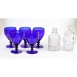 A set of five Bristol blue glass goblets, h.14cm; together with two cut glass decanters