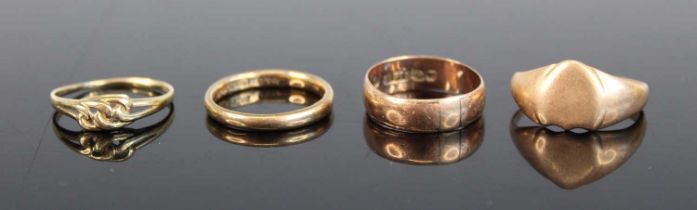 A 9ct gold signet ring (cut), together with a 9ct gold wedding band, one other, and a 9ct gold