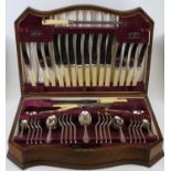 A walnut cased canteen of silver plated cutlery, width 52cm, together with a silver plated tray,