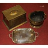 A collection of metal ware to include a brass coal scuttle, a silver plated drinks tray, and a brass