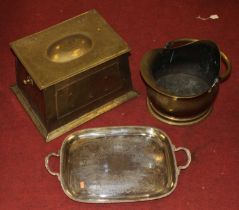 A collection of metal ware to include a brass coal scuttle, a silver plated drinks tray, and a brass