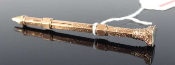 A Victorian 9ct gold propelling pen and pencil, of engraved hexagonal form, having bloodstone set