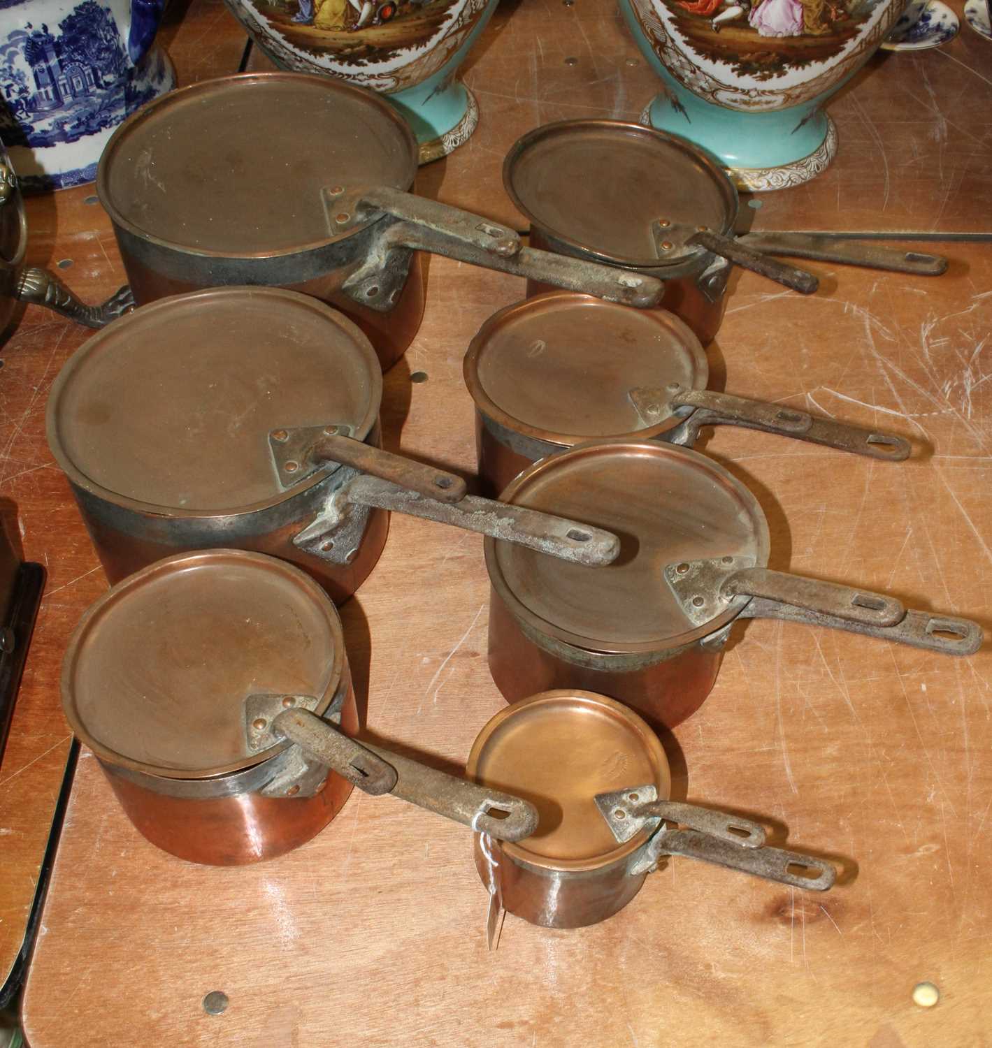 A set of seven Victorian copper pans, the largest dia. 24cm