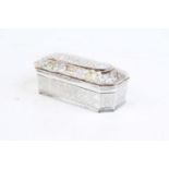 An early 20th century Eastern white metal table casket, of sarcophagus form, the hinged lid with