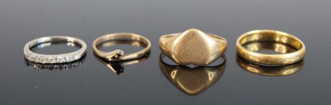 A 9ct gold heart shaped signet ring, together with a yellow metal wedding band, unmarked but tests