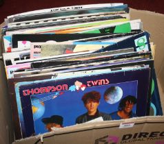 A collection of vintage LPs to include The Thompson Twins, Elvis Presley and The Stray Cats