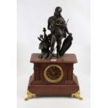 A 19th century rouge marble mantel clock, the dial showing gilt Roman numerals, having an eight