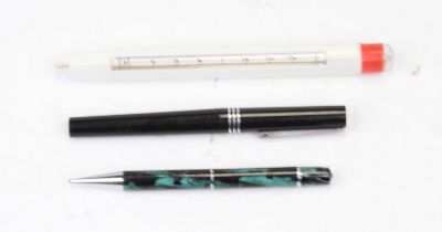 An Osmiroid fountain pen, having a black cap and barrel, with white metal clip and banding, with