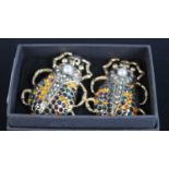 A pair of gilt metal and paste set oversize scarab beetle ear pendants, height 45mm
