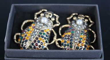 A pair of gilt metal and paste set oversize scarab beetle ear pendants, height 45mm