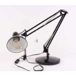 A black painted metal angle poise desk lamp