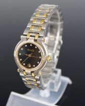 A lady's Gucci bi-metal quartz bracelet watch, case dia.25mm, with box, outer box and papers