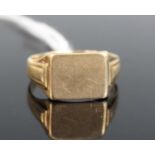 A 9ct yellow gold rectangular signet ring, with stepped shoulders, size T, gross weight 3.6g,
