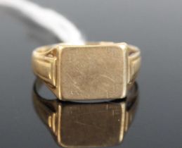 A 9ct yellow gold rectangular signet ring, with stepped shoulders, size T, gross weight 3.6g,