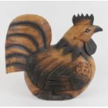 A large carved wood model of a hen, h.42cm