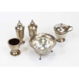 A pair of George VI silver pedestal pepperettes; together with a George V silver sugar bowl;