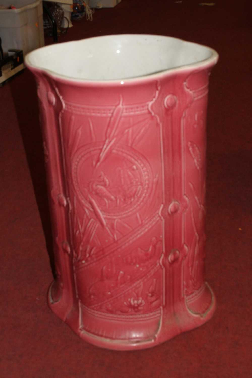A Victorian pink glazed pottery stickstand, h.60cm With some big cracks, chips and repairs.