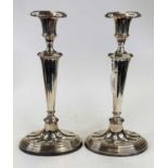 A pair of 19th century Sheffield plate table candle sticks, of fluted oval shape, height 31cm