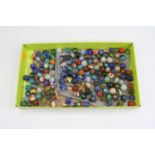 A collection of assorted coloured glass marbles, varying sizes