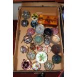 A collection of coloured glass paperweights, to include Strathearn and Mdina