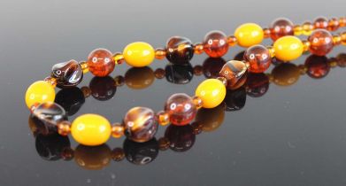 A faux amber beaded necklace; together with a pair of modern 9ct gold and sapphire set ear