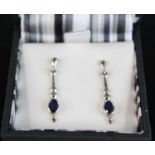 A pair of modern 9ct white gold sapphire set ear pendants, on post fittings, 29mm, 2.5g