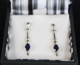 A pair of modern 9ct white gold sapphire set ear pendants, on post fittings, 29mm, 2.5g