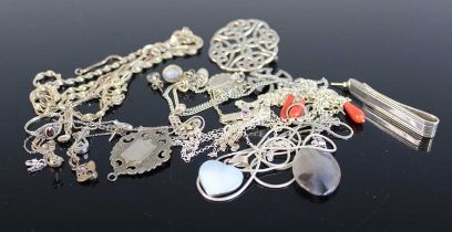 A collection of principally modern silver and white metal costume jewellery to include pendants,