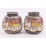 A pair of West German pottery vases, each relief decorated with a bull, h.19cm