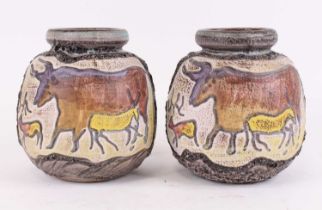 A pair of West German pottery vases, each relief decorated with a bull, h.19cm