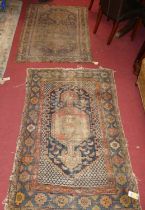 Two Persian woollen Tabriz rugs, each heavily faded and worn