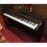 A Roland electric upright piano This works and sounds very good.All keys and buttons working.Some