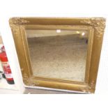 A circa 1900 giltwood and gesso floral decorated square wall mirror (with replacement