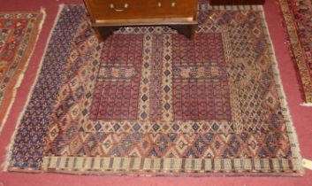 A Persian woollen red ground Bokhara prayer rug, 142 x 123cm