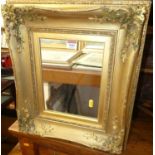 A circa 1900 gilt composition picture frame, with later inset mirrorplate, full dimensions 47 x